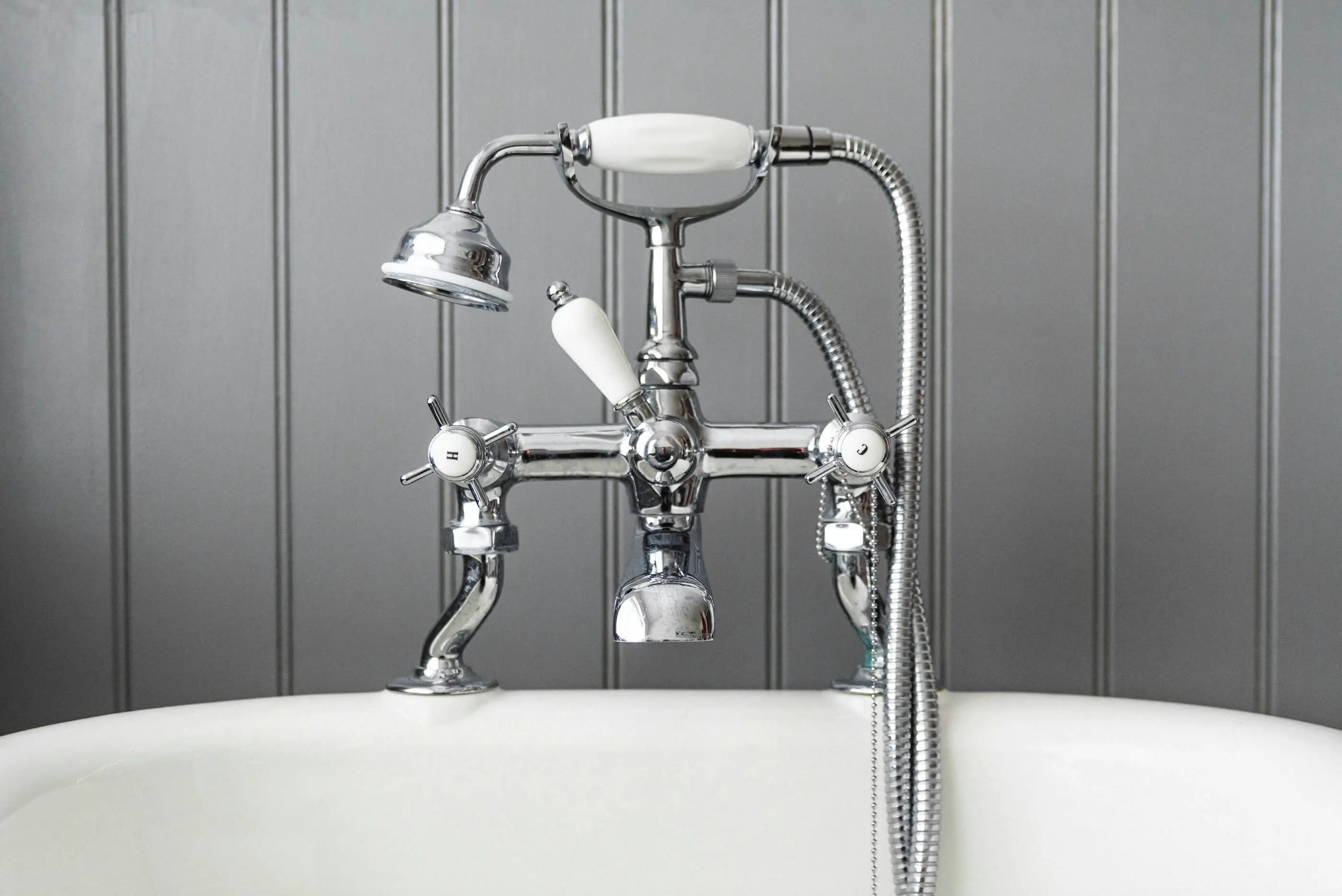 Vintage-style tub faucet with handheld shower attachment